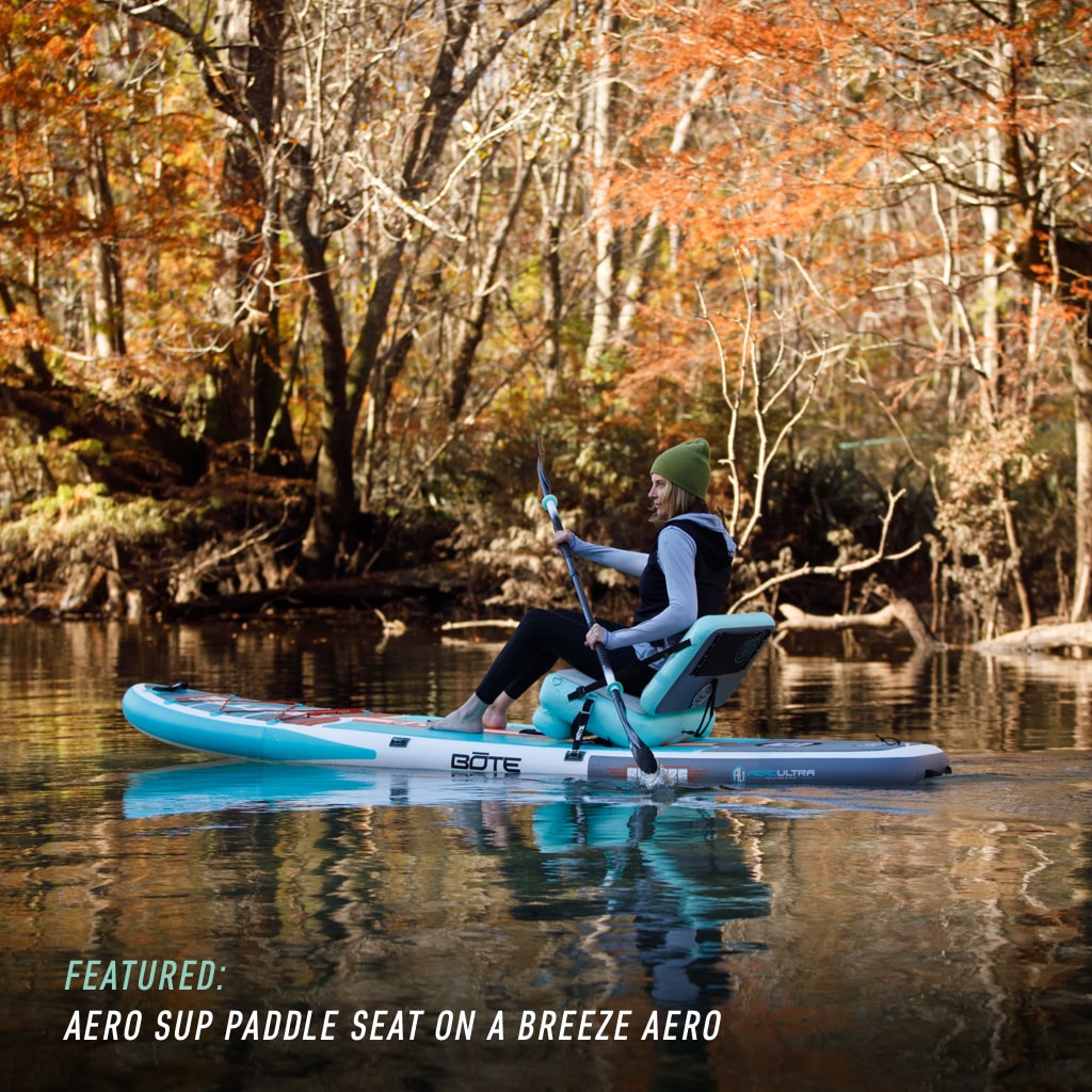 Picture of a woman paddling on a Breeze Aero using the Aero SUP Seat
