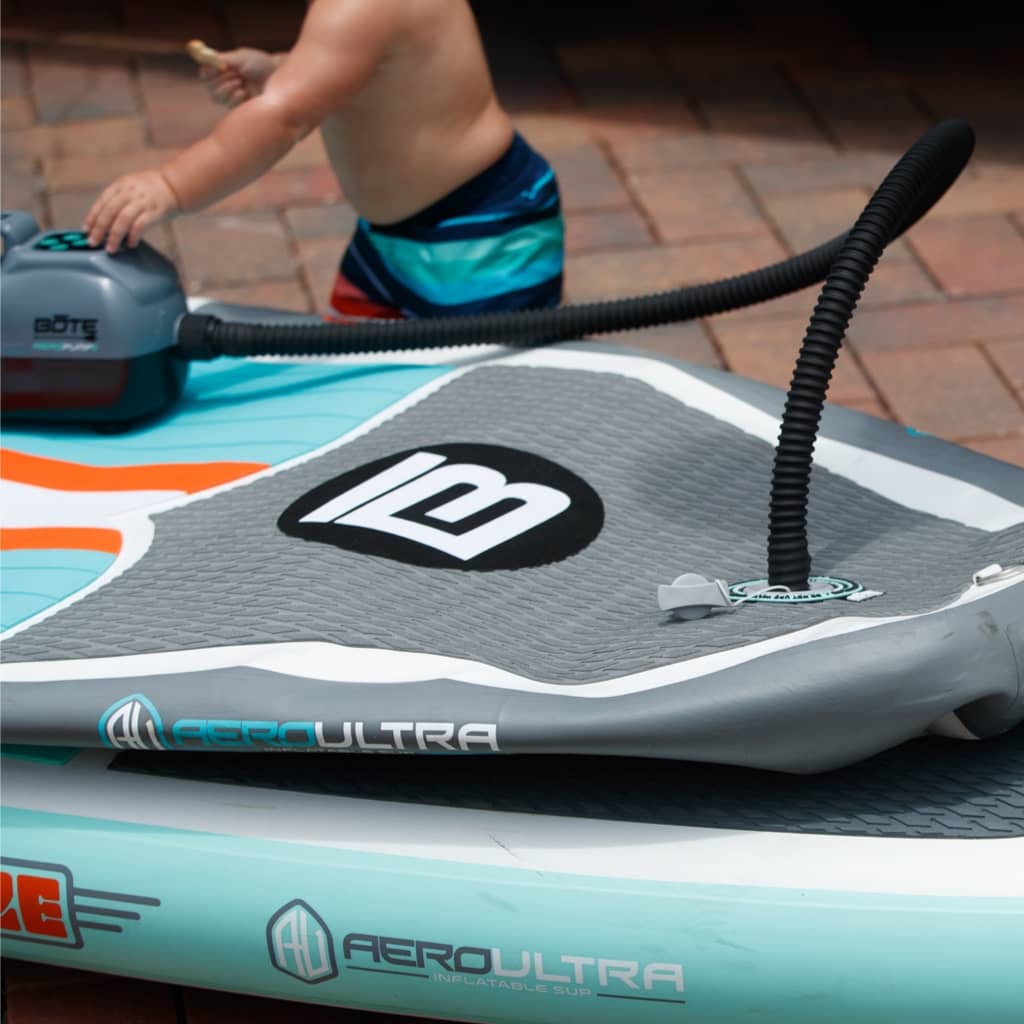 The AeroPump Auto Electric Pump II pumping up an inflatalble paddle board