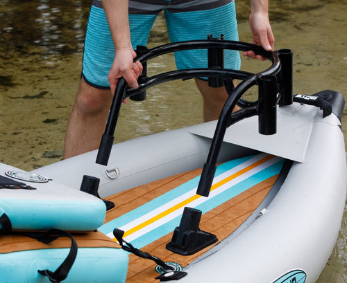 Angled front view of Bucket Rac Black with four rod holders and curved support bar.