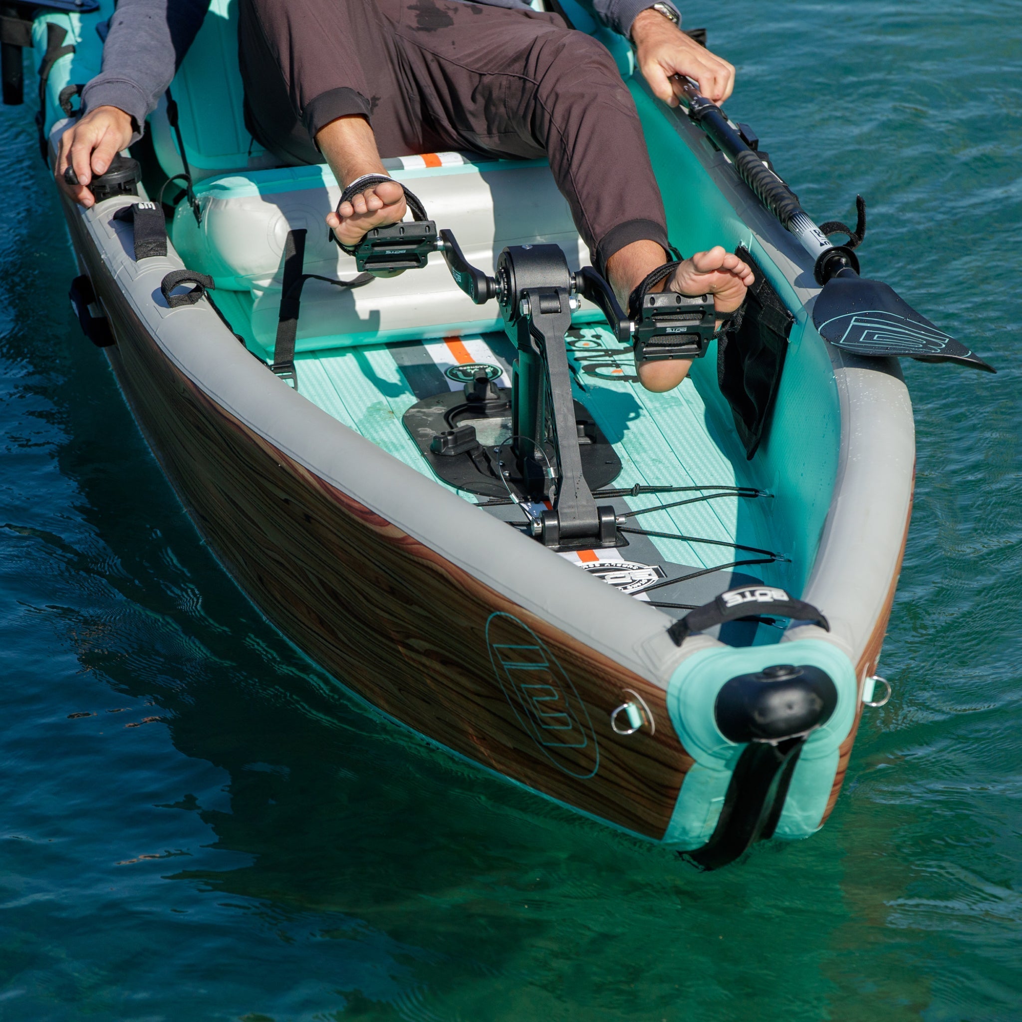 Person using the APEX Pedal Drive and Rudder System to pedal a LONO Aero