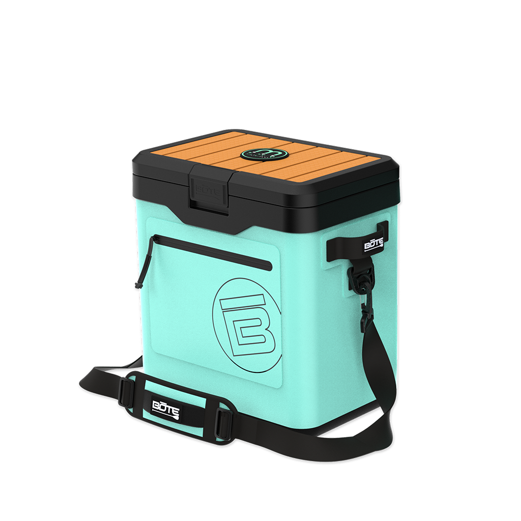 Angled front view of KULA Mule cooler in mint with black lid and shoulder strap.