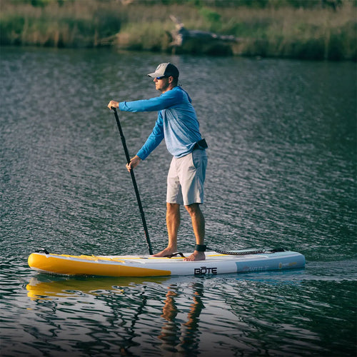 A guy paddling on a WULF Aero Inflatable Paddle Board